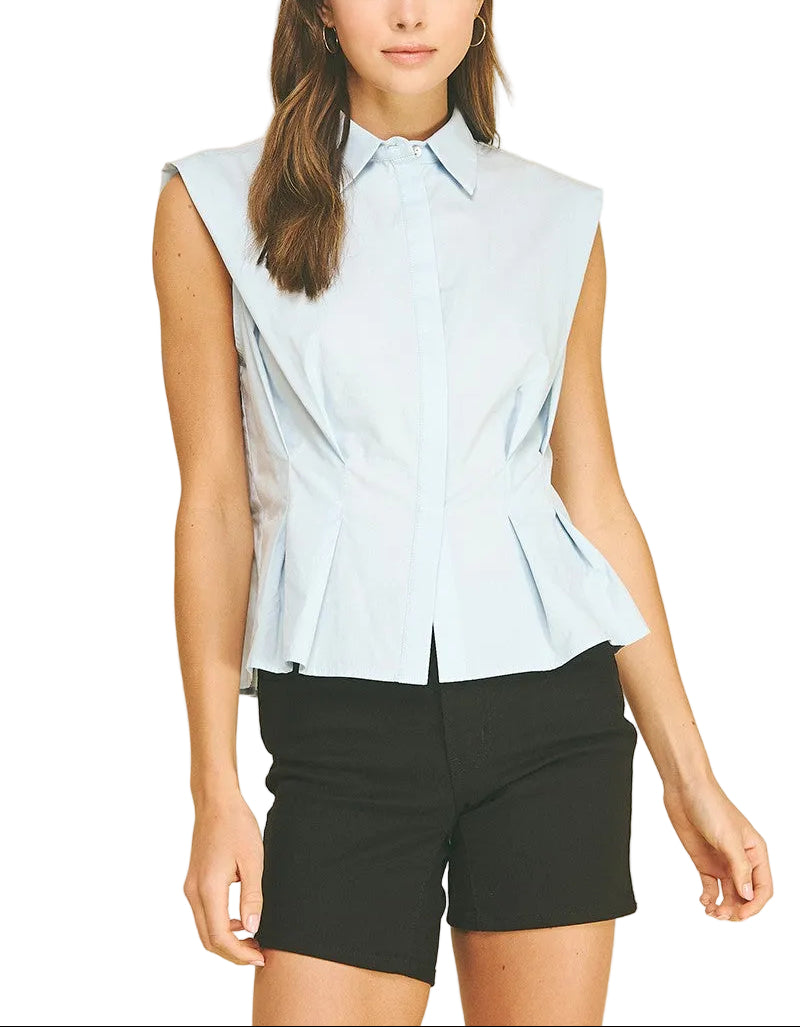 Effortless elegance meets modern style with the Molly Sleeveless Shirt in Light Blue. This versatile button-down features a flattering peplum waist that adds dimension and movement to your silhouette. The sleeveless design keeps you cool and comfortable, while the crisp button front allows for easy layering or standalone wear. Perfect for office settings, casual outings, or weekend brunch—dress it up with tailored trousers or down with your favorite denim. 
