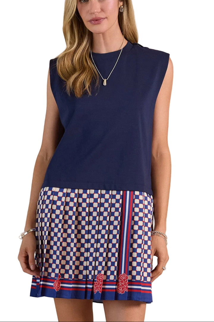 Effortless elegance meets playful style in this charming mini dress. The knit dropped waist top features a relaxed, comfortable fit that skims the body, while the woven pleated skirt adds movement and dimension with its crisp, structured folds. The navy multi colorway brings versatility to your wardrobe—dress it up with heels for evening or keep it casual with sneakers for daytime wear. Perfect for transitional seasons, this piece combines two distinct textures for visual interest and all-day comfort.