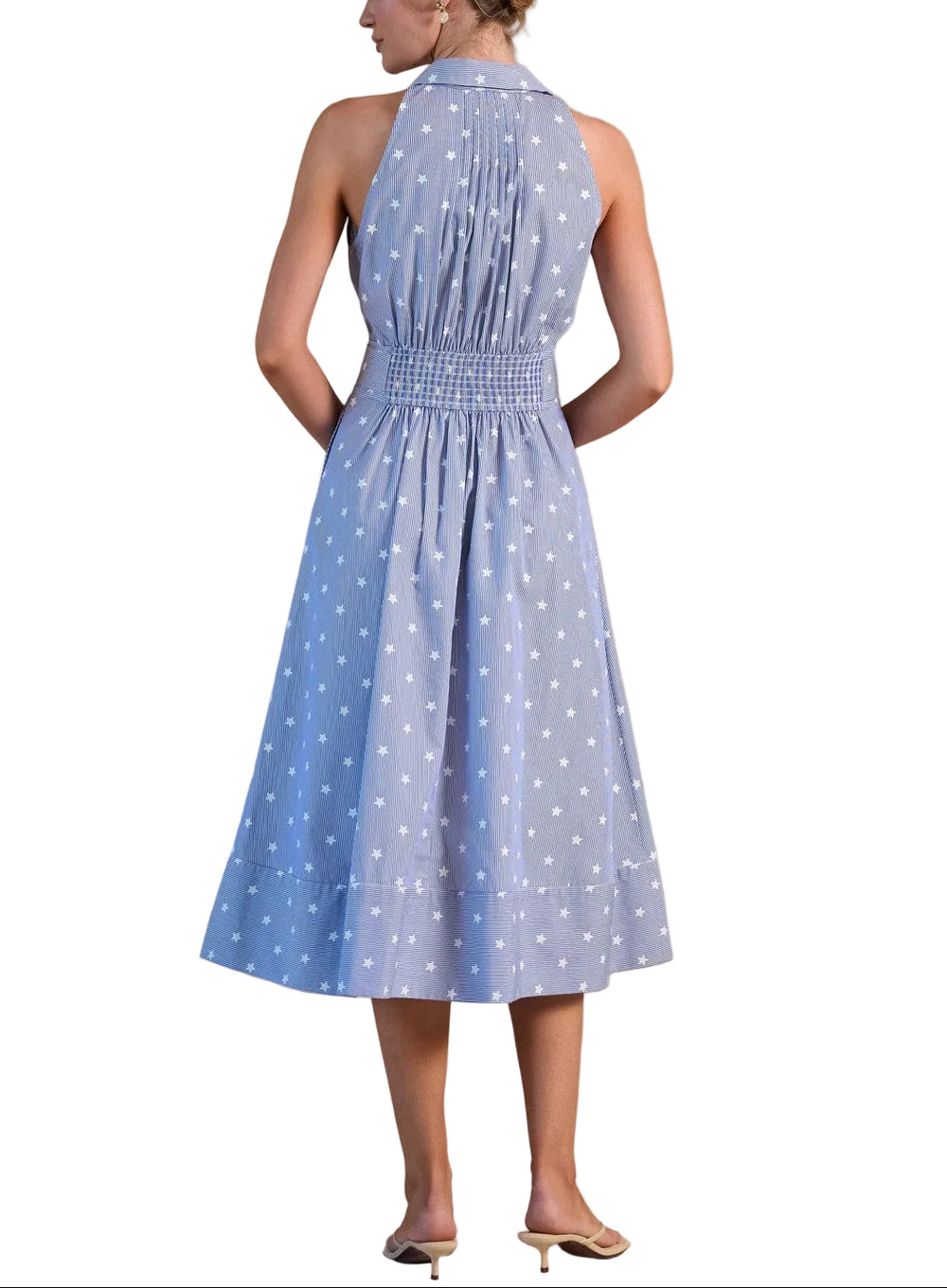 Effortless elegance meets timeless style with this sleeveless midi dress, featuring a striking blue and white star print. The relaxed fit and midi length create a flattering silhouette perfect for warm weather occasions, from casual outings to garden parties. Pair with sandals for a breezy daytime look or dress up with heels for evening wear. A versatile wardrobe essential that transitions seamlessly from season to season.