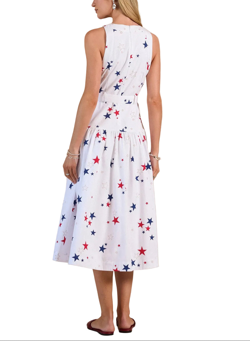 Effortless elegance meets playful style with the Cassie Star Printed Midi Dress. This sleeveless design features an eye-catching star print in vibrant multi-colors, perfect for creating a statement look that transitions seamlessly from day to evening. The midi length offers a flattering silhouette while maintaining comfort and ease of movement. Ideal for warm weather occasions, casual outings, or dressed up with accessories for a more polished appearance. 