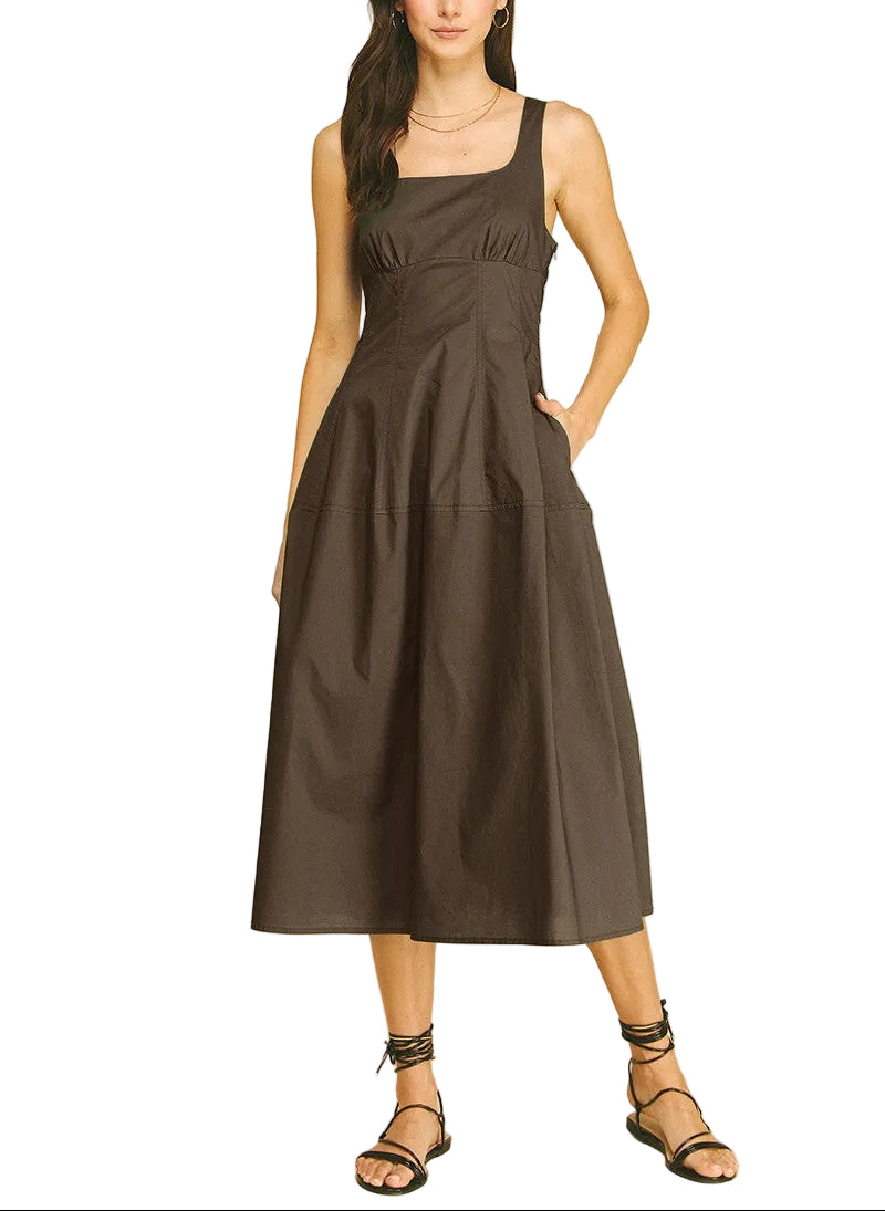 The Marisa Midi Dress offers effortless elegance for any occasion. This sleeveless design features a flattering midi length that skims the body gracefully, making it perfect for warm weather styling. The clean, minimalist silhouette pairs easily with sandals for casual outings or heels for evening events. Versatile and comfortable, it&