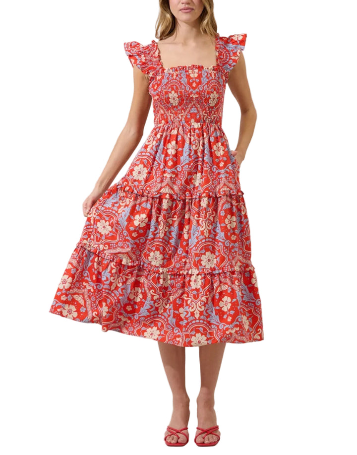 Where every step feels like a garden. Multi florals sit on a red background to create this dress. It features a smocked body with ruffle shoulders. It has tiers on the bottom fun skirt. Pair with your favorite heels.
