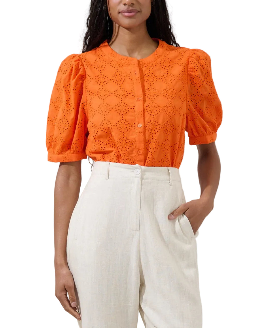 Pretty little details, major style moment! An inspired eyelet embroidery throughout, shapes this blouse that has puff short sleeves and a bodice with a functional button placket at the front. Easy to pair with white pants!