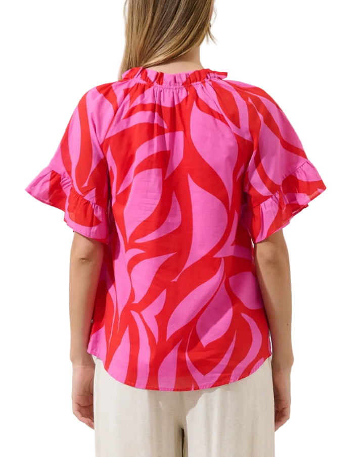 Made for sunshine and sweet moments. This pretty top features short wide sleeves and a split neckline with a tassel tie in the front. Pair it with denim shorts and espadrilles for the perfect look.