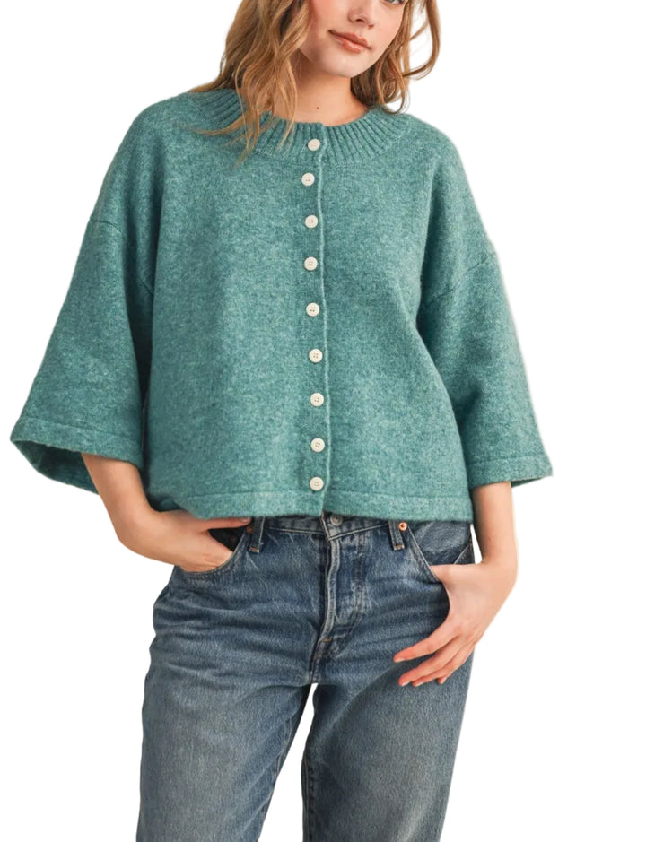 The Katie Knit Cardigan Sweater is a timeless layering essential crafted from soft, quality knit fabric. Featuring a classic button-front closure and comfortable fit, this cardigan transitions seamlessly from casual to polished looks.&amp;nbsp;
