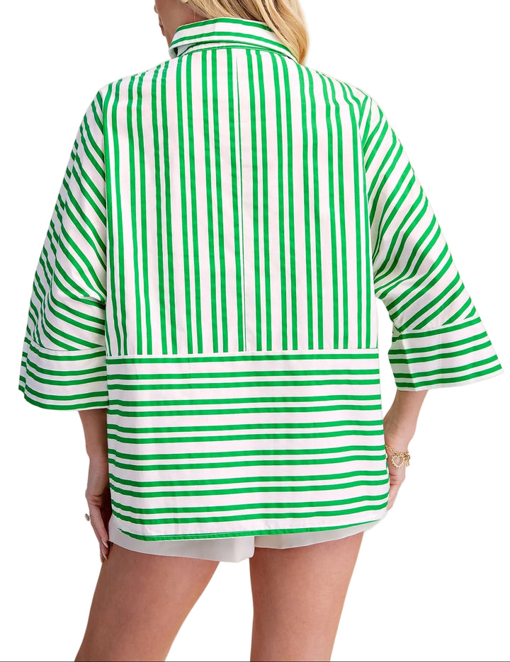 The Roxanne Oversize Stripe Shirt brings effortless style to your everyday wardrobe. Featuring bold stripes and a classic lapel collar, this relaxed-fit piece layers beautifully over basics or stands alone as a statement top. The generous cut offers comfort and movement, while the timeless stripe pattern works with virtually any outfit. Perfect for casual days, weekend outings, or dressed up with tailored pieces.