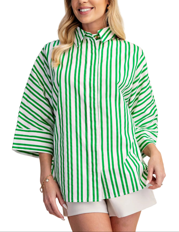 The Roxanne Oversize Stripe Shirt brings effortless style to your everyday wardrobe. Featuring bold stripes and a classic lapel collar, this relaxed-fit piece layers beautifully over basics or stands alone as a statement top. The generous cut offers comfort and movement, while the timeless stripe pattern works with virtually any outfit. Perfect for casual days, weekend outings, or dressed up with tailored pieces.