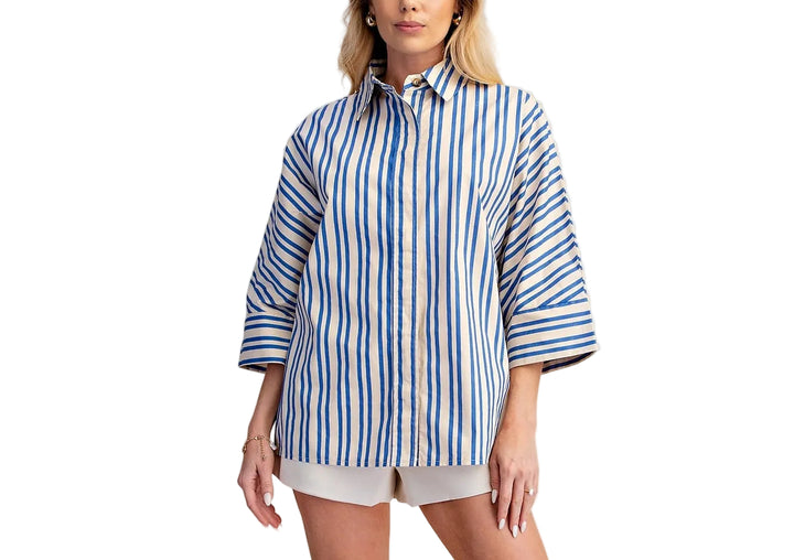 The Roxanne Oversize Stripe Shirt brings effortless style to your everyday wardrobe. Featuring bold stripes and a classic lapel collar, this relaxed-fit piece layers beautifully over basics or stands alone as a statement top. The generous cut offers comfort and movement, while the timeless stripe pattern works with virtually any outfit. Perfect for casual days, weekend outings, or dressed up with tailored pieces.