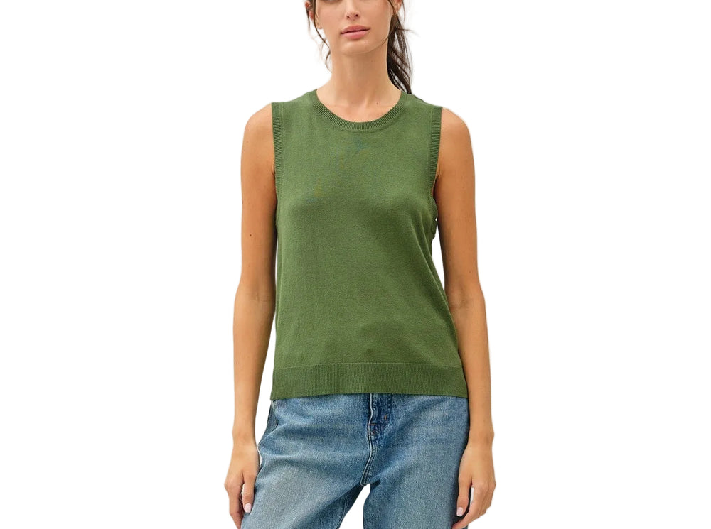 The Francis Sleeveless Sweater offers effortless layering versatility with its classic crew neck design. Perfect for transitional seasons, this piece works beautifully over collared shirts, tees, or on its own. The sleeveless silhouette provides freedom of movement while maintaining a polished, put-together look. Ideal for both casual and professional settings, it's a wardrobe essential that pairs seamlessly with everything from jeans to tailored trousers.