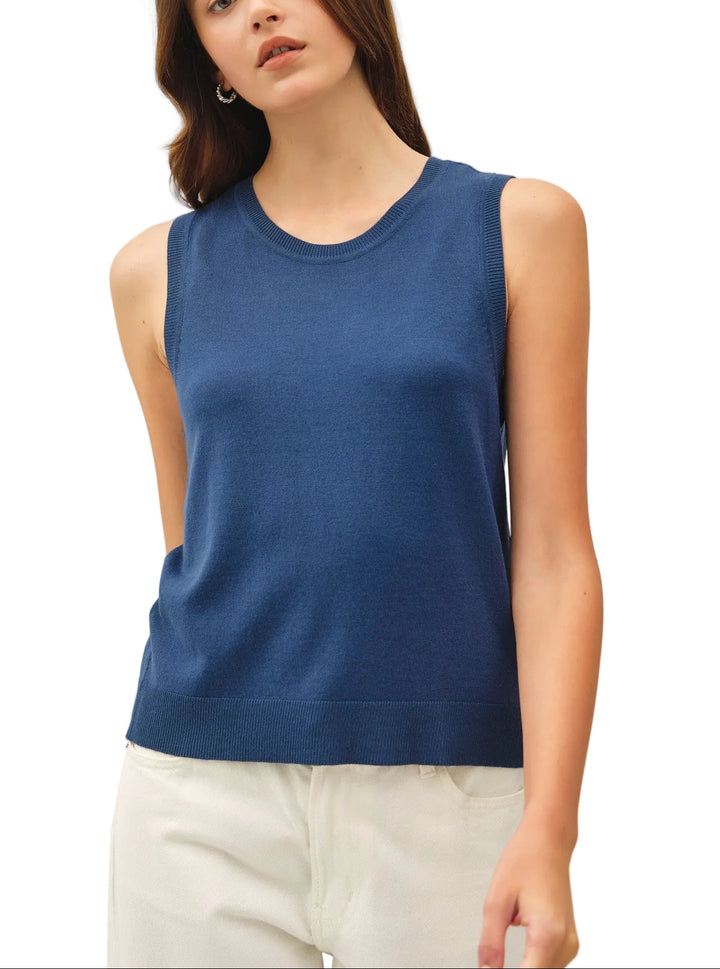 The Francis Sleeveless Sweater offers effortless layering versatility with its classic crew neck design. Perfect for transitional seasons, this piece works beautifully over collared shirts, tees, or on its own. The sleeveless silhouette provides freedom of movement while maintaining a polished, put-together look. Ideal for both casual and professional settings, it&