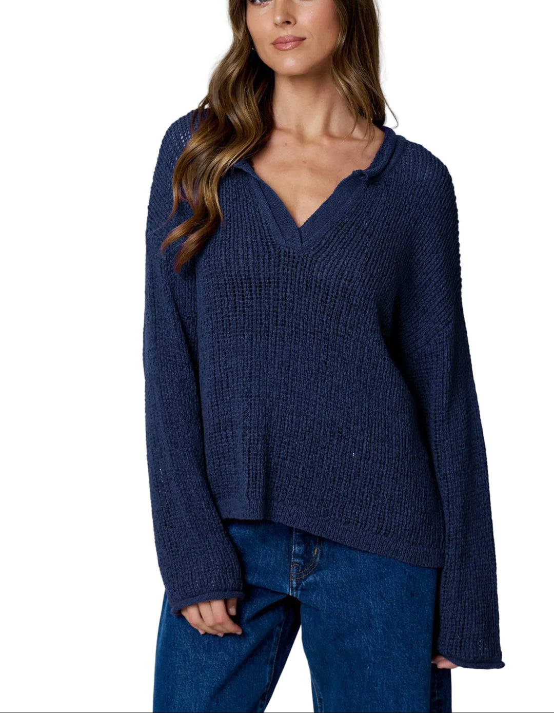 The Bev Long Sleeve Sheer Knit Sweater features a striking raw edge split neckline that adds modern edge to your everyday wardrobe. Crafted from lightweight sheer knit fabric, this sweater offers a delicate, breathable feel perfect for layering or wearing solo over a fitted tee. The long sleeves provide coverage while maintaining an airy aesthetic. Ideal for transitional seasons, this piece effortlessly elevates casual outfits with its contemporary design and soft texture.