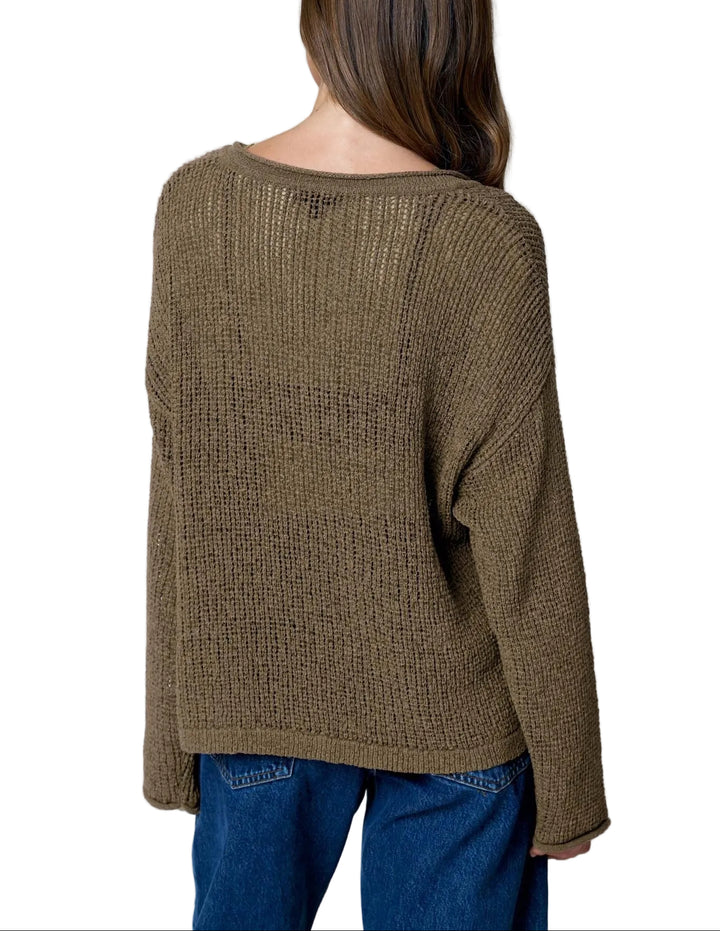 The Bev Long Sleeve Sheer Knit Sweater features a striking raw edge split neckline that adds modern edge to your everyday wardrobe. Crafted from lightweight sheer knit fabric, this sweater offers a delicate, breathable feel perfect for layering or wearing solo over a fitted tee. The long sleeves provide coverage while maintaining an airy aesthetic. Ideal for transitional seasons, this piece effortlessly elevates casual outfits with its contemporary design and soft texture.