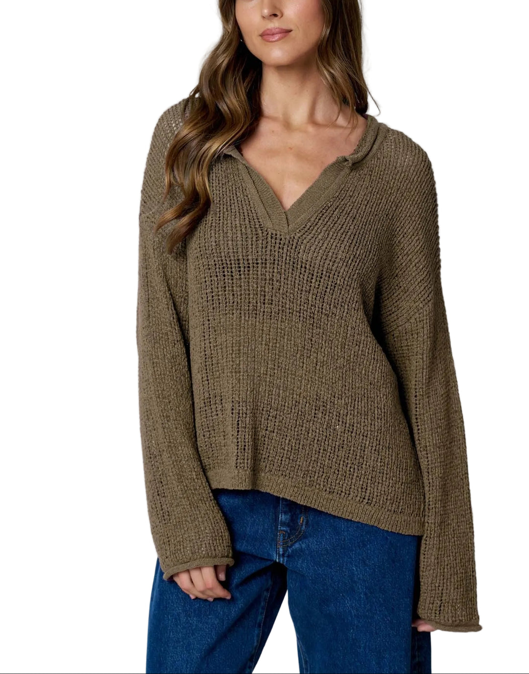 The Bev Long Sleeve Sheer Knit Sweater features a striking raw edge split neckline that adds modern edge to your everyday wardrobe. Crafted from lightweight sheer knit fabric, this sweater offers a delicate, breathable feel perfect for layering or wearing solo over a fitted tee. The long sleeves provide coverage while maintaining an airy aesthetic. Ideal for transitional seasons, this piece effortlessly elevates casual outfits with its contemporary design and soft texture.