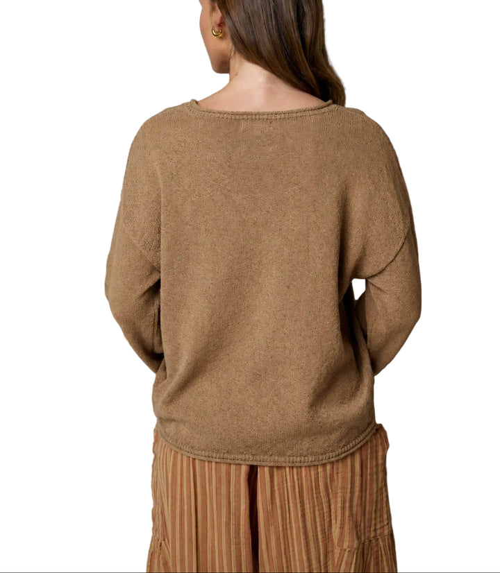The Betsy Textured Long Sleeve Sweater features a distinctive raw edge design that adds modern appeal to a timeless wardrobe staple. Crafted with a soft, textured knit, this long sleeve sweater offers comfort and style for everyday wear. The raw edge detailing along the neckline and cuffs creates an effortlessly cool, contemporary look. Perfect for layering or wearing solo, this sweater transitions seamlessly from season to season.