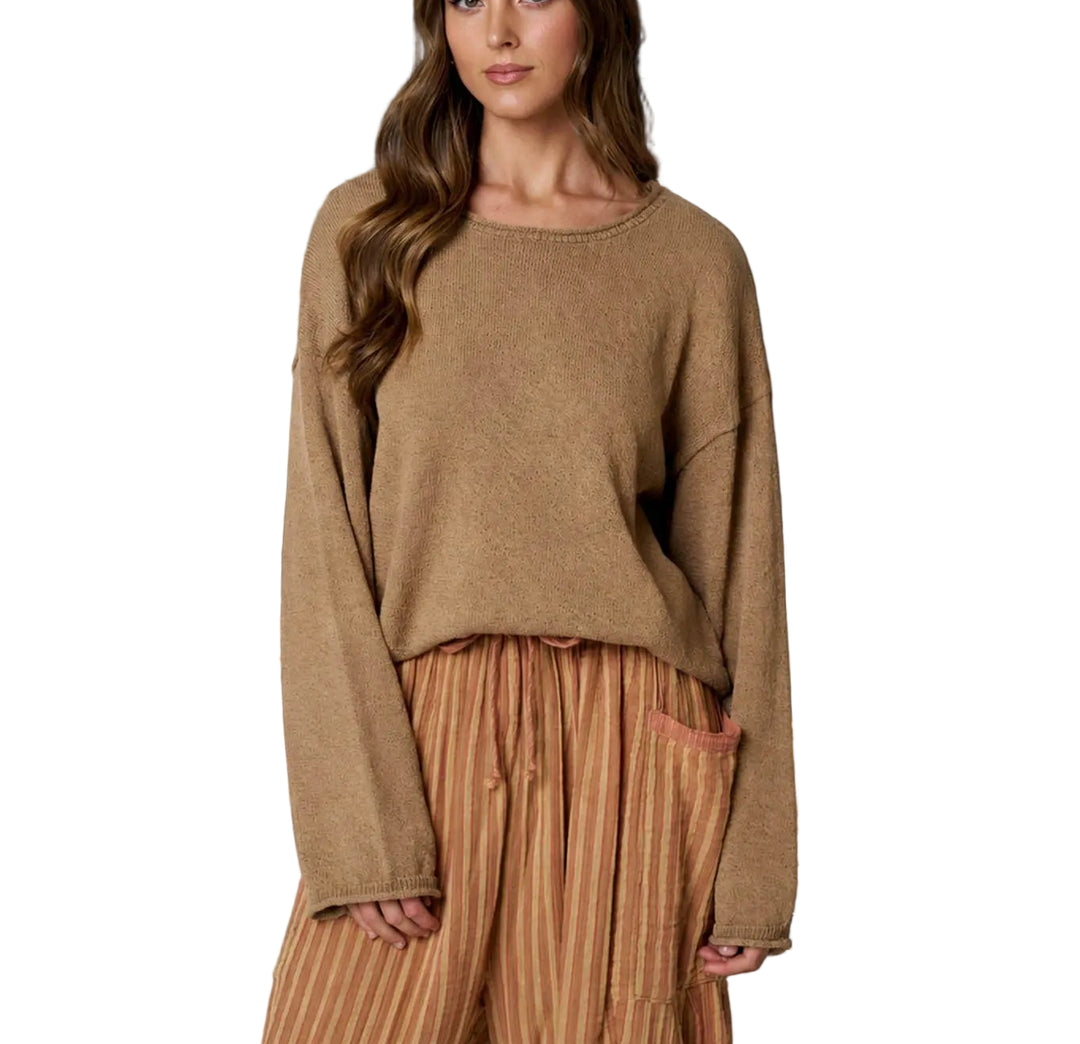 The Betsy Textured Long Sleeve Sweater features a distinctive raw edge design that adds modern appeal to a timeless wardrobe staple. Crafted with a soft, textured knit, this long sleeve sweater offers comfort and style for everyday wear. The raw edge detailing along the neckline and cuffs creates an effortlessly cool, contemporary look. Perfect for layering or wearing solo, this sweater transitions seamlessly from season to season.