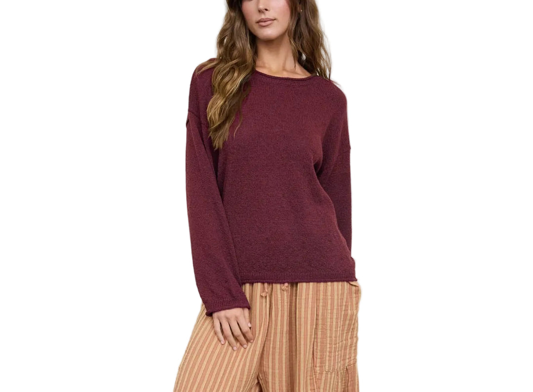 The Betsy Textured Long Sleeve Sweater features a distinctive raw edge design that adds modern appeal to a timeless wardrobe staple. Crafted with a soft, textured knit, this long sleeve sweater offers comfort and style for everyday wear. The raw edge detailing along the neckline and cuffs creates an effortlessly cool, contemporary look. Perfect for layering or wearing solo, this sweater transitions seamlessly from season to season.