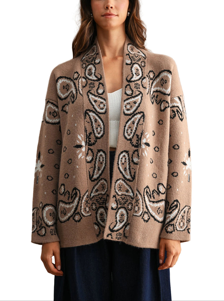 Timeless elegance meets everyday comfort in this Jackie Paisley Pattern Cardigan. Featuring an intricate paisley design, this piece layers beautifully over dresses, tees, or sweaters for effortless style. The soft, breathable fabric drapes gracefully while maintaining its shape, making it perfect for transitional seasons. Button-front closure and classic silhouette ensure versatility across your wardrobe. A sophisticated staple that works from office to weekend.