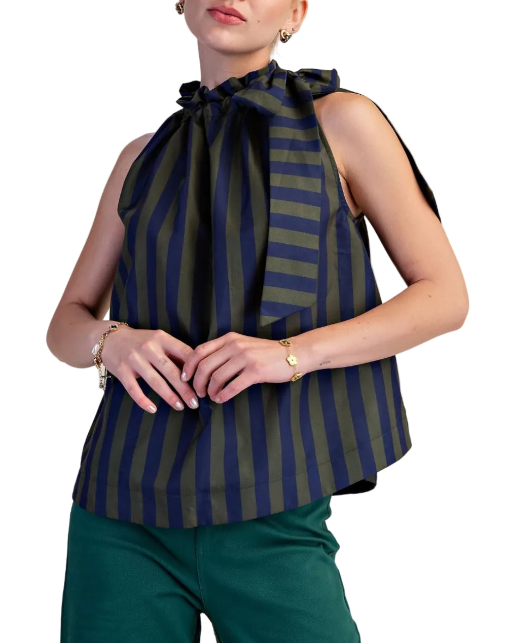 Make a vibrant statement with this eye-catching sleeveless top, designed for the modern woman who loves to stand out. Featuring a bold, vertical stripe pattern in a striking combination of pop color and deep soft color, this halter-neck blouse is sure to turn heads. The playful ruffled neckline artfully gathers into a chic bow at the front, adding a touch of feminine charm and sophistication. 