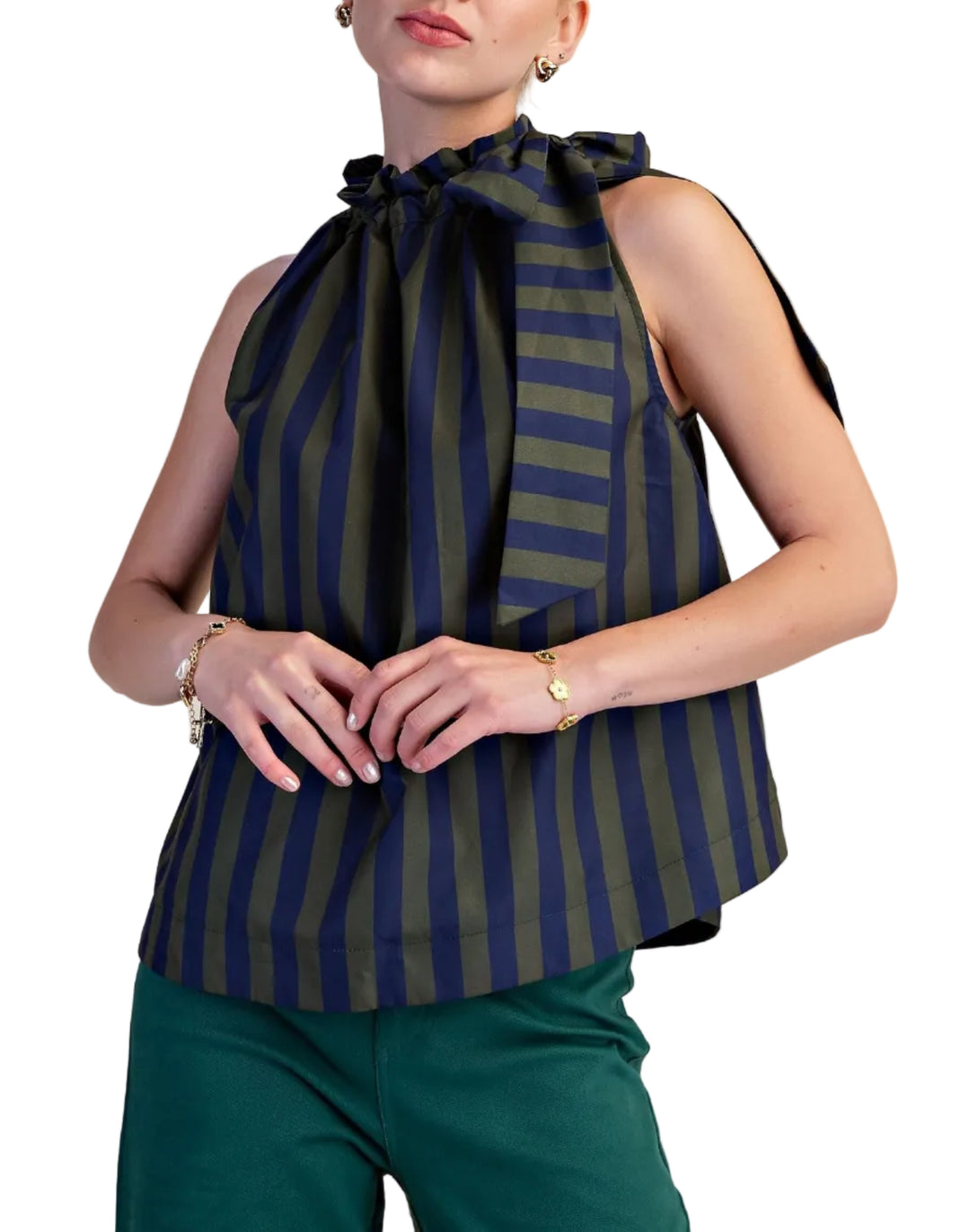 Make a vibrant statement with this eye-catching sleeveless top, designed for the modern woman who loves to stand out. Featuring a bold, vertical stripe pattern in a striking combination of pop color and deep soft color, this halter-neck blouse is sure to turn heads. The playful ruffled neckline artfully gathers into a chic bow at the front, adding a touch of feminine charm and sophistication. 