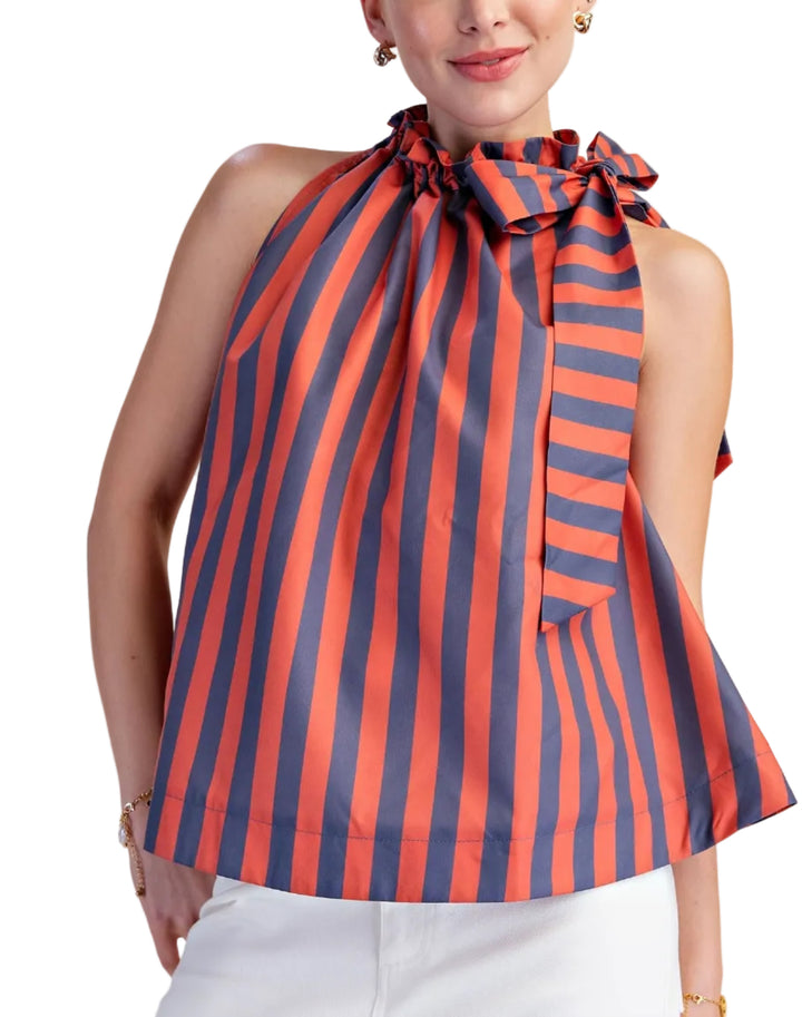 Make a vibrant statement with this eye-catching sleeveless top, designed for the modern woman who loves to stand out. Featuring a bold, vertical stripe pattern in a striking combination of pop color and deep soft color, this halter-neck blouse is sure to turn heads. The playful ruffled neckline artfully gathers into a chic bow at the front, adding a touch of feminine charm and sophistication. 