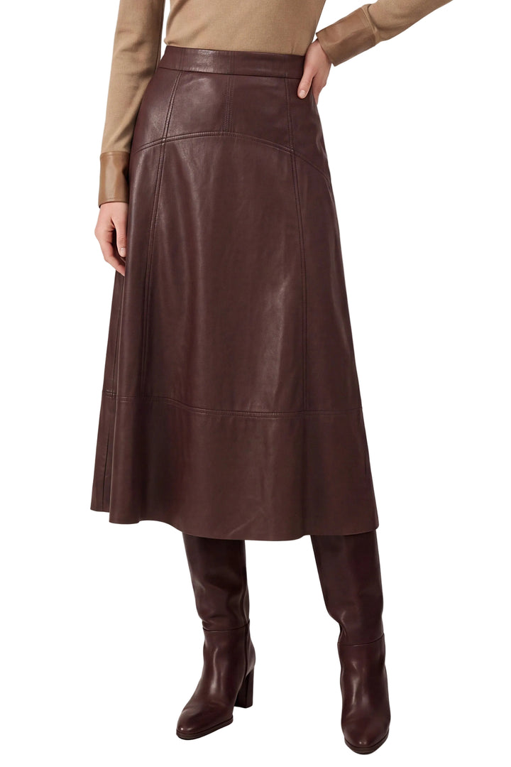 Elevate your wardrobe with the Greta Burgundy Faux Leather Midi Skirt, a sophisticated piece that seamlessly transitions from day to evening. The rich burgundy hue and buttery-soft faux leather construction create a luxurious look without the maintenance of genuine leather. A flattering midi length provides elegant coverage while the sleek silhouette cinches at the waist for a refined shape. Pair with a crisp white blouse for timeless polish or a fitted sweater for contemporary edge. 