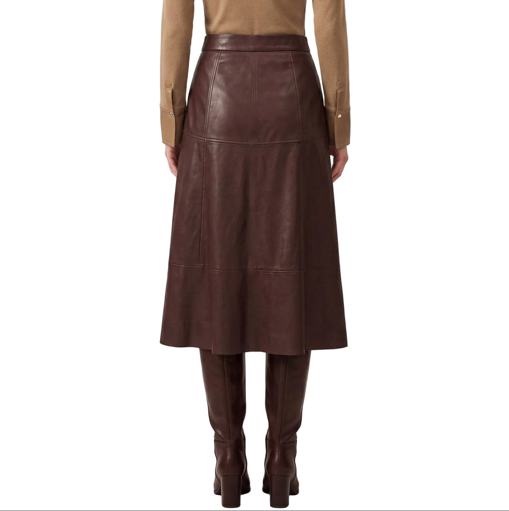 Elevate your wardrobe with the Greta Burgundy Faux Leather Midi Skirt, a sophisticated piece that seamlessly transitions from day to evening. The rich burgundy hue and buttery-soft faux leather construction create a luxurious look without the maintenance of genuine leather. A flattering midi length provides elegant coverage while the sleek silhouette cinches at the waist for a refined shape. Pair with a crisp white blouse for timeless polish or a fitted sweater for contemporary edge.