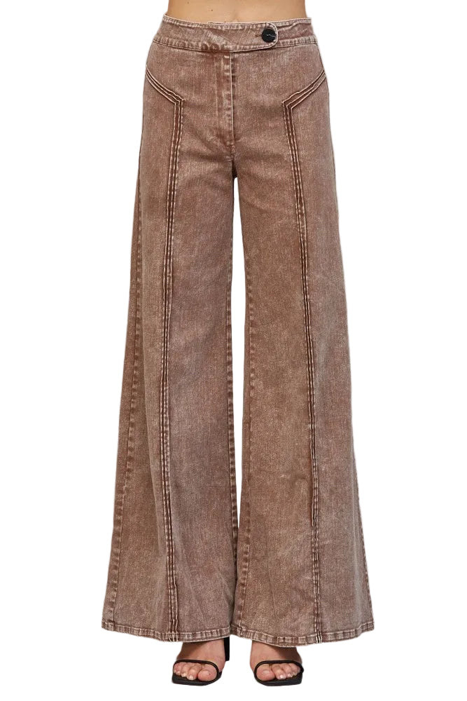 A pair of wide-leg cropped pants in a washed brown or taupe corduroy-like fabric, shown on a model from the waist down against a neutral gray background.