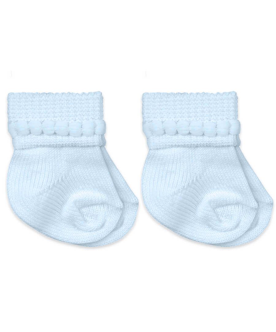 Pair of light blue baby socks on a white background