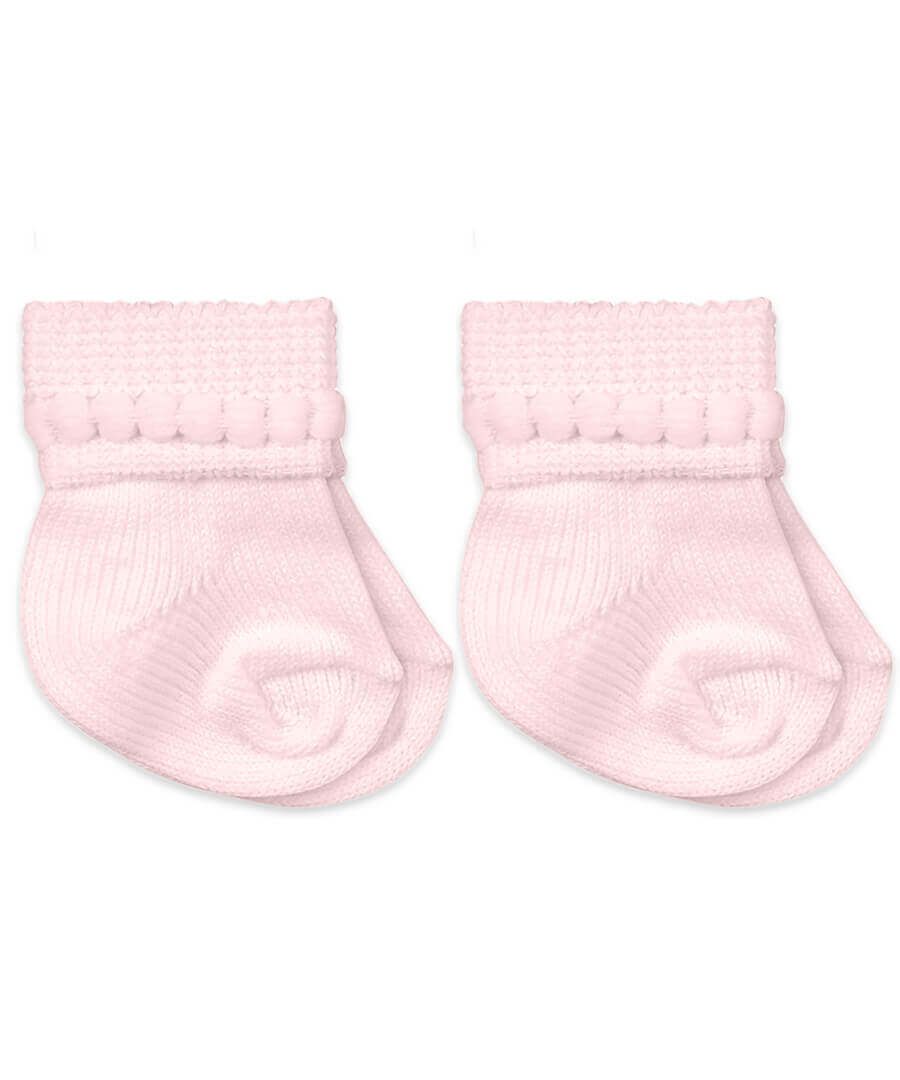 Pair of pink baby socks on a white background