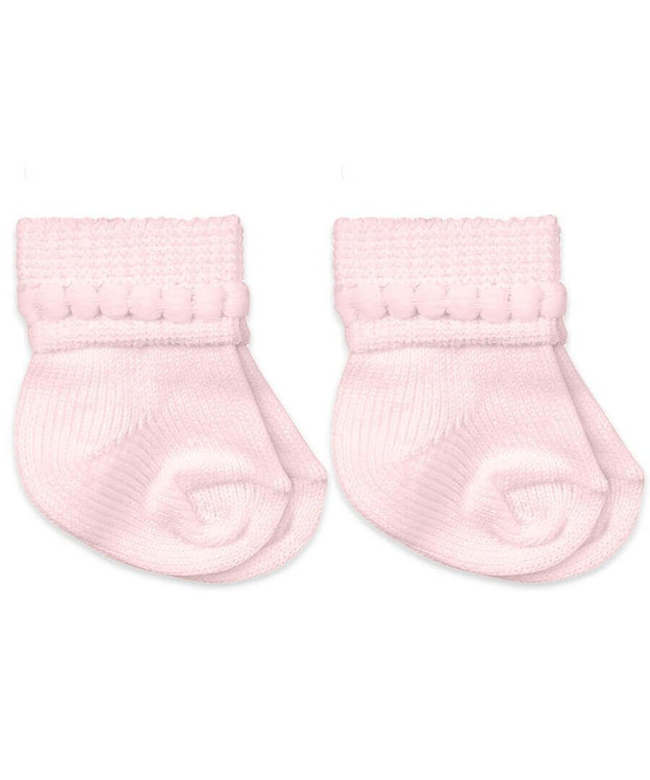 Pair of pink baby socks on a white background