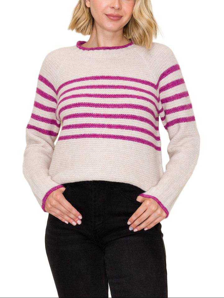 Bring a pop of fun to your wardrobe with the Polly Striped Sweater! This cozy crew neck features cheerful stripes that brighten any day while keeping you snug. Perfect for layering or wearing solo, it’s the playful twist your outfit has been waiting for.