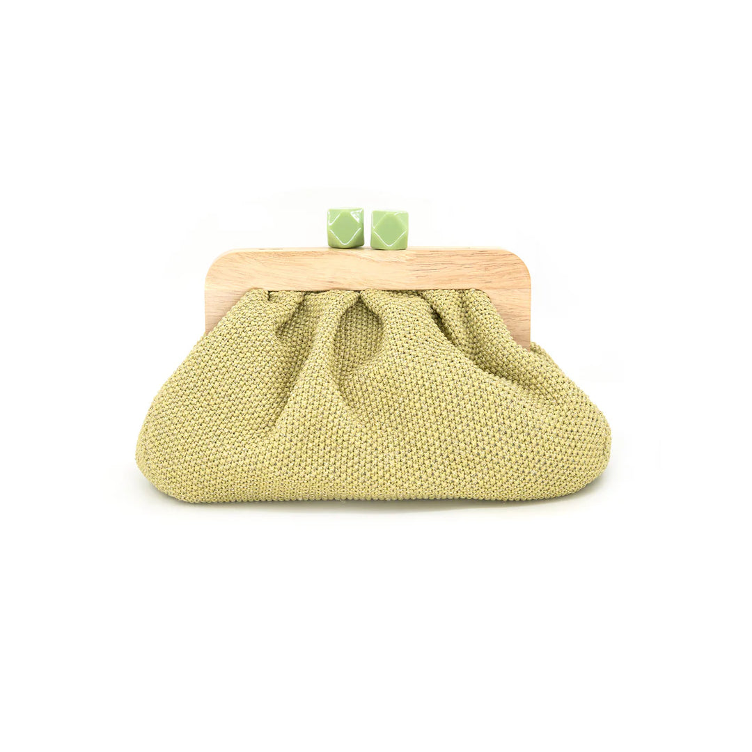Weave a little magic into your everyday carry with the Lia Straw Clutch. This charming accessory pairs natural woven straw with a warm wood handle, creating the perfect blend of texture and sophistication. Whether you're heading to brunch, the beach, or a weekend getaway, this clutch adds an effortless, breezy vibe to any outfit. Lightweight yet spacious, it's your go-to companion for keeping essentials organized in style
