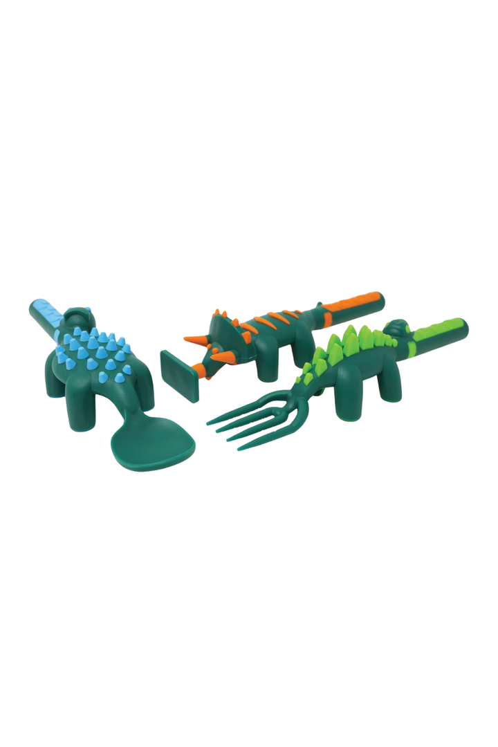 Set of toy dinosaur tools on a white background