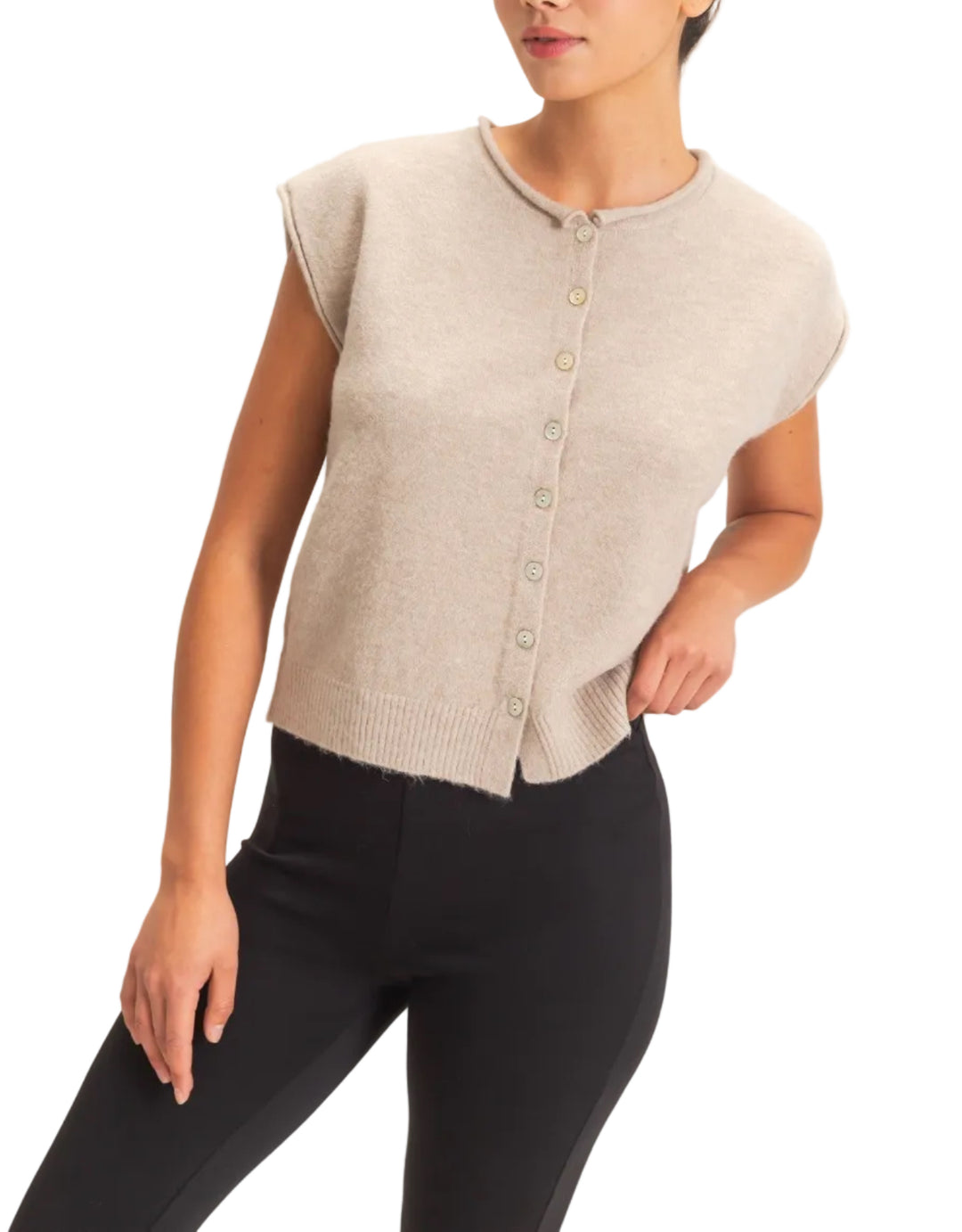 This sleeveless button front sweater vest features a classic rolled crew neckline and a relaxed silhouette, perfect for layering. Crafted with precision, it offers an elevated look with its ribbed hem. Pair it with high-waisted denim and a statement belt for a chic ensemble.

