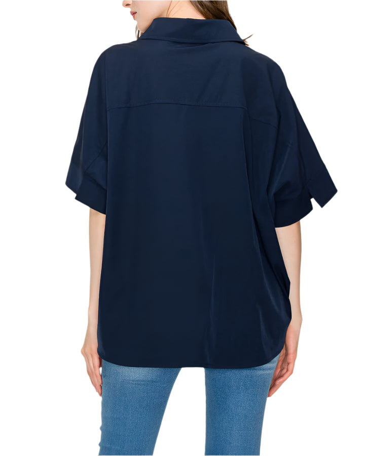 The Jerra Top. Casual everyday blouse made with high quality woven stretch parachute. Loose fitting. Half sleeve. Button up. Collar. Cinch at waist. Small pleat detail. Easy relax fit. Stylist and comfort.