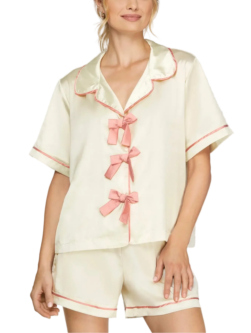 Slip into comfort with the Bridget Satin Short Pajama Set. Crafted from smooth, breathable satin, this two-piece set features a short-sleeve top and matching shorts for effortless lounging and restful sleep. The luxurious fabric drapes beautifully while keeping you cool throughout the night. Perfect for everyday wear or as a thoughtful gift, this pajama set combines elegance with everyday comfort.