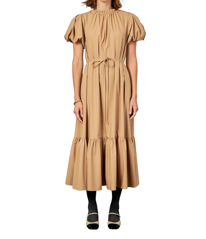 Introducing our Skinny Belted Midi Dress the perfect addition to your wardrobe. Designed with a flattering midi length this dress is both trendy and versatile. Featuring convenient side seam pockets you can keep your essentials close at hand. The elegant neck ruffle detail adds a touch of sophistication while the back button closure with keyhole completes the look. Ideal for any occasion this dress is a must-have for any fashion-forward woman. Shop now and upgrade your style game effortlessly.