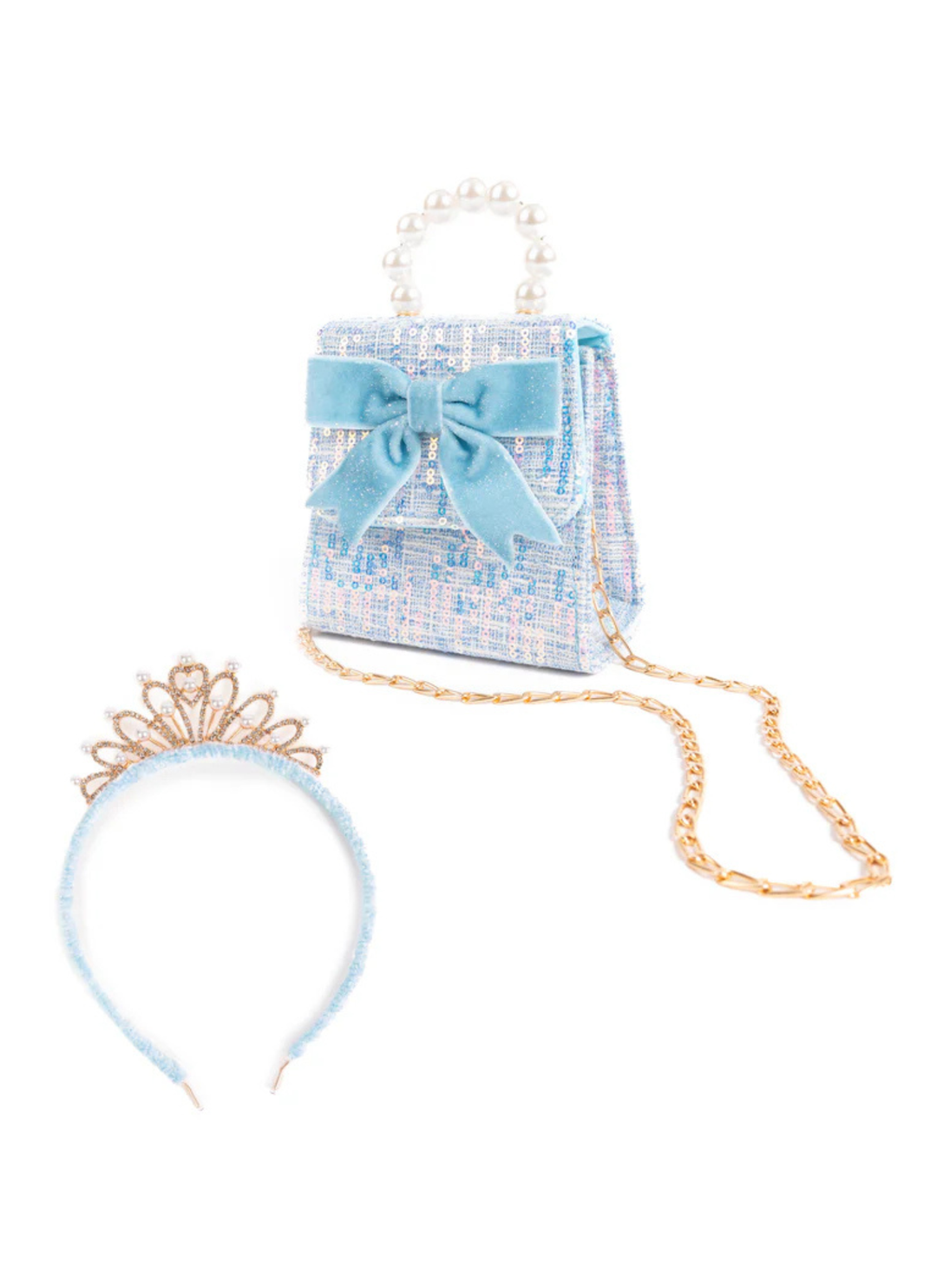 Elegant and eye-catching, The Mademoiselle Mini Purse with Headband, Blue or Pink is a beautifully coordinated set designed to shine. The purse features layered sequins and a statement bow, complemented by a refined pearl handle.&amp;nbsp;The matching headband is finished with a gold crown, creating a regal look.