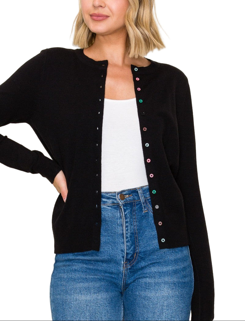 Add a pop of fun to your wardrobe with the Susannah Cardigan, featuring a classic solid color body accented by playful multi-color buttons. These vibrant buttons bring cheerful contrast and make every outfit a little more joyful, perfect for brightening up chilly days or layering in style. Soft, cozy, and full of personality!