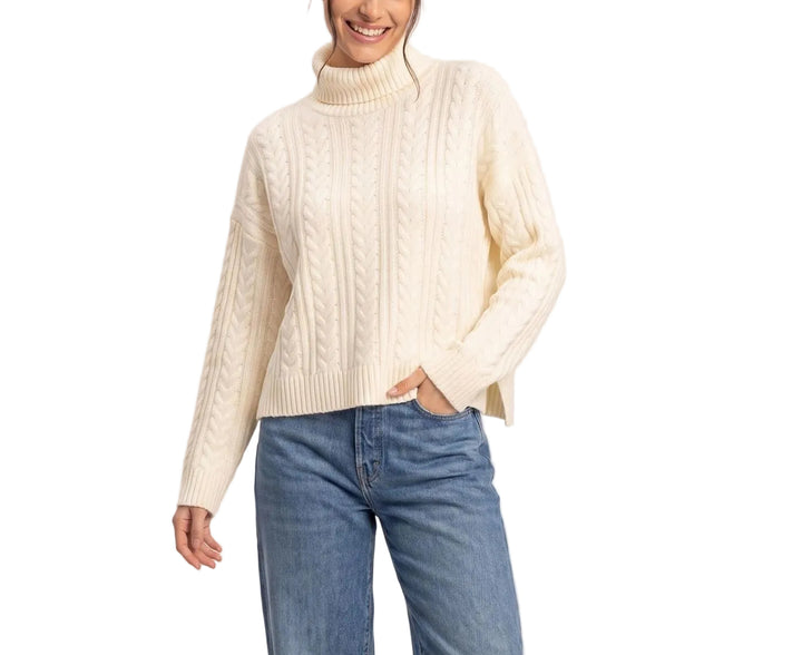 Effortless sophistication meets timeless comfort in the Marisa Cable Knit Turtleneck Sweater. This classic piece features a chunky cable knit texture that adds visual interest and warmth, perfect for layering or wearing solo. The fitted turtleneck and ribbed cuffs provide a polished silhouette, while the soft knit fabric drapes beautifully against the skin. Ideal for cooler seasons, this versatile sweater pairs seamlessly with jeans, trousers, or skirts for an elevated everyday look.