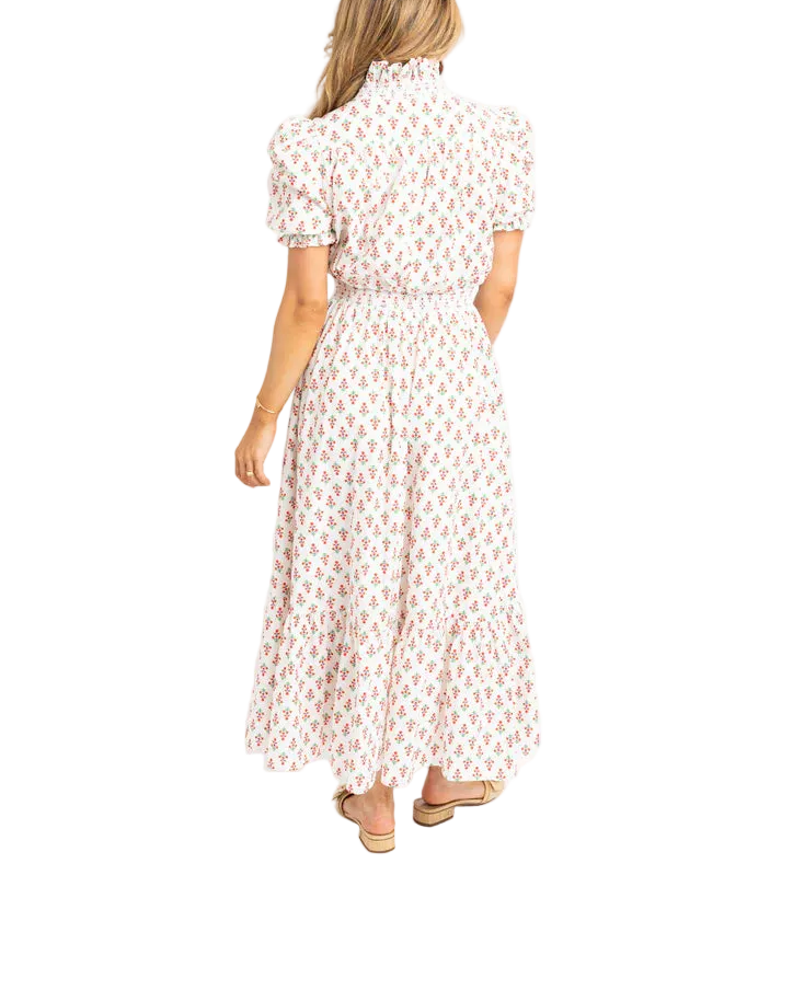 Effortless elegance meets comfort in this digital floral ruffle smock maxi dress. The soft ivory base features a vibrant all-over floral print that brings movement and personality to your wardrobe. Delicate ruffles frame the neckline and sleeves, while the relaxed smock silhouette provides a flattering, breathable fit perfect for warm weather. The flowing maxi length offers timeless sophistication for casual outings, garden parties, or weekend getaways.