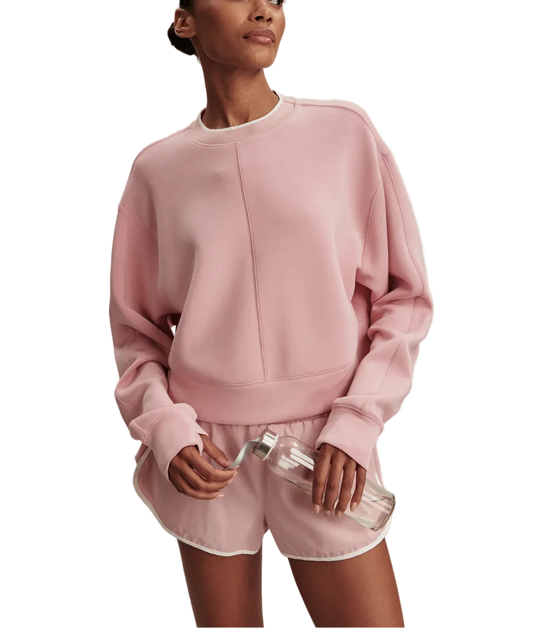 A cropped sweat top with an oversized silhouette is a stylish off-duty companion. The Tasmin features a relaxed dropped sleeve, rib neckline, and statement contrast color stripe.