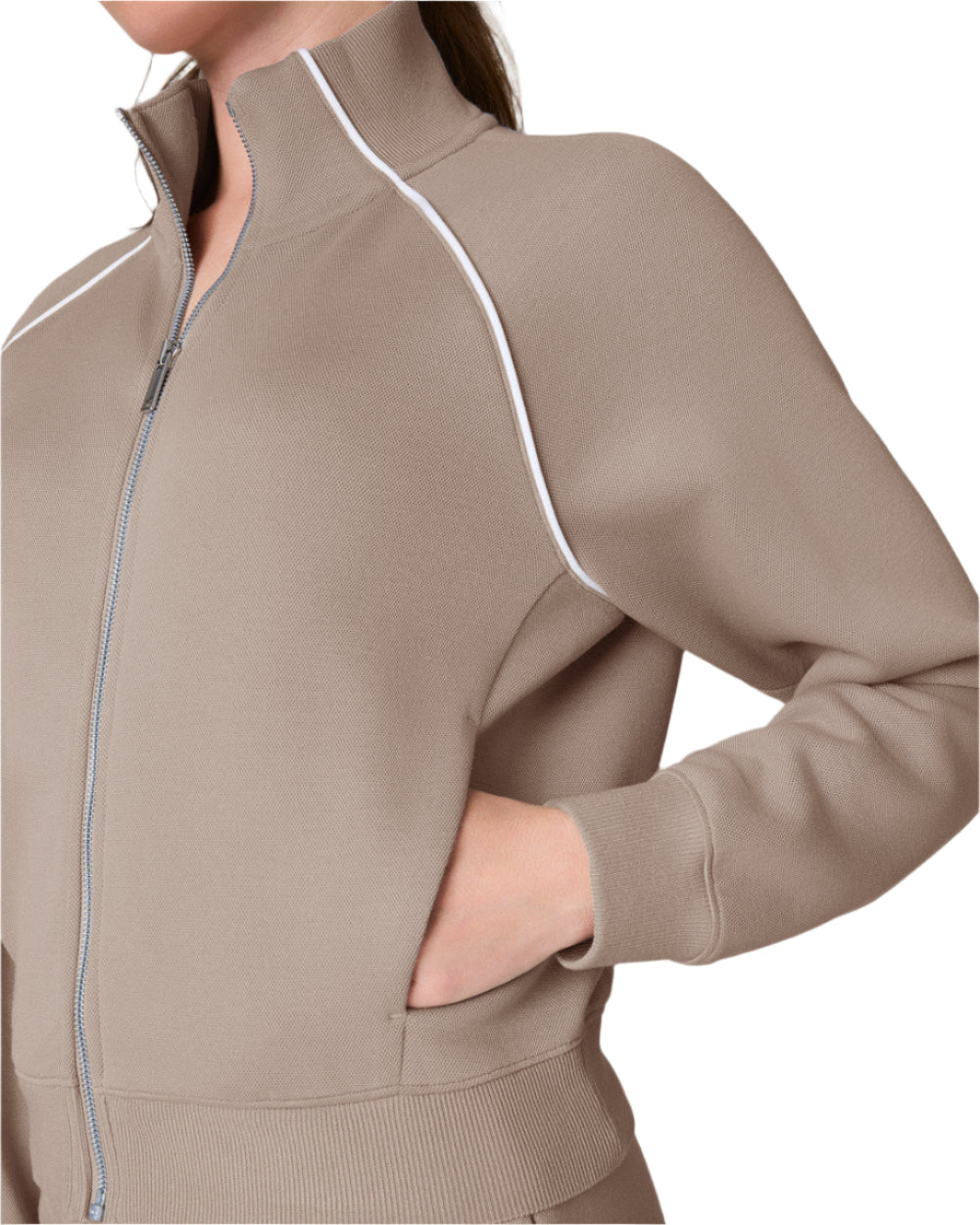 Our SPANX® AirEssentials Pique Full Zip Track Jacket is made with the same lightweight, breathable, and oh-so soft AirEssentials fabric you know and love, now with a pique application for a subtly textured look and feel. This track jacket features convenient front pockets, a full-length zipper and distinctive striped details for an easy, sporty look. Designed with 4-way stretch, it's perfect for all-day wear—whether you're traveling, running errands, or lounging at home.