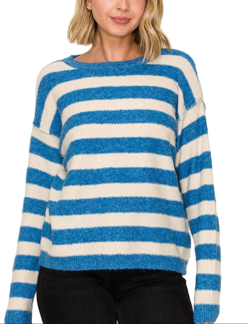 Wrap yourself in cozy charm with the Shannon Striped Crew Neck Sweater. Its playful stripes and classic crew neck make it the perfect pick for brightening up chilly days. Soft and comfortable, this sweater pairs effortlessly with your favorite jeans or skirts for a fun, laid-back look. Get ready to turn heads and stay snug all season long!