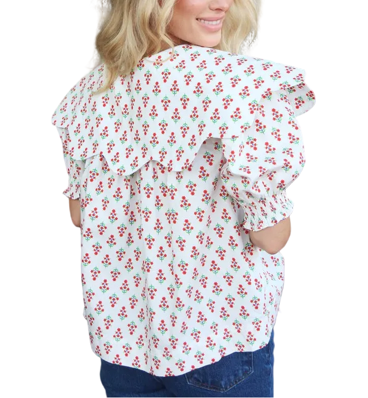 Elevate your everyday wardrobe with this charming digital floral collar button top in ivory. The classic collar and button-front design offer timeless sophistication, while the vibrant digital floral print adds a modern, artistic touch. Crafted for comfort and style, this versatile piece transitions seamlessly from casual outings to polished occasions. Perfect for layering or wearing solo, it&