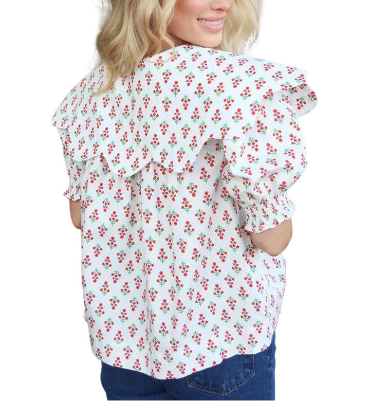 Elevate your everyday wardrobe with this charming digital floral collar button top in ivory. The classic collar and button-front design offer timeless sophistication, while the vibrant digital floral print adds a modern, artistic touch. Crafted for comfort and style, this versatile piece transitions seamlessly from casual outings to polished occasions. Perfect for layering or wearing solo, it&