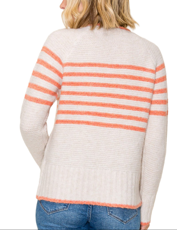 Bring a pop of fun to your wardrobe with the Polly Striped Sweater! This cozy crew neck features cheerful stripes that brighten any day while keeping you snug. Perfect for layering or wearing solo, it’s the playful twist your outfit has been waiting for.