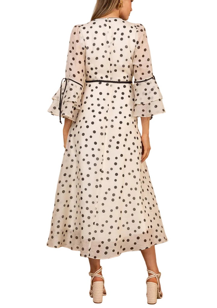 Twirl into elegance with the Aiyana Organza Maxi Dress, where ethereal silk organza meets whimsical charm. This stunning floor-length gown features a delicate ruffle and piping detail at the neckline, adding a touch of playful sophistication. Perfect for special occasions, garden parties, or whenever you want to feel like the most graceful version of yourself. The luxurious fabric drapes beautifully, creating movement with every step.