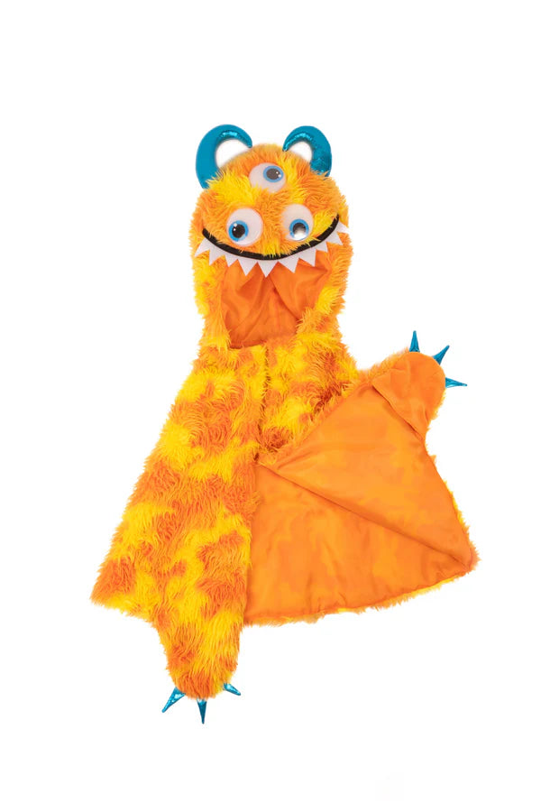 Unleash your imagination with the Giggle or Swampy the Monster Capes! This playful and vibrant cape features bright orange and yellow fur or green and blue fur, perfect for adding a fun pop of color to any costume. The hood is adorned with whimsical blue googly eyes and a toothy smile, while the metallic horns and claws bring a touch of sparkle and excitement. Whether they&