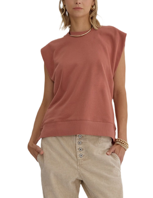 Solid round neck sleeveless top featuring rib detail at neckline and hem.